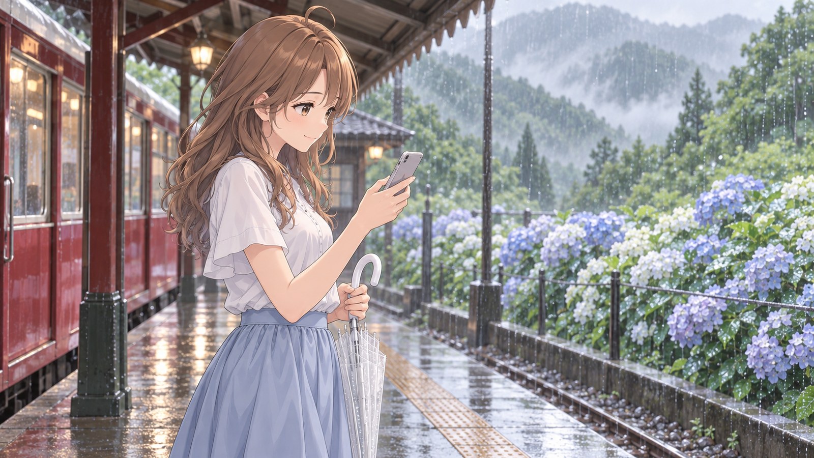 雨の朝、山の駅のホームで、白い半袖のブラウスと水色のスカートの主人公が、閉じたビニール傘を手にスマートフォンの画面を見てほほえむ。後ろに赤い登山電車と雨に濡れたあじさい