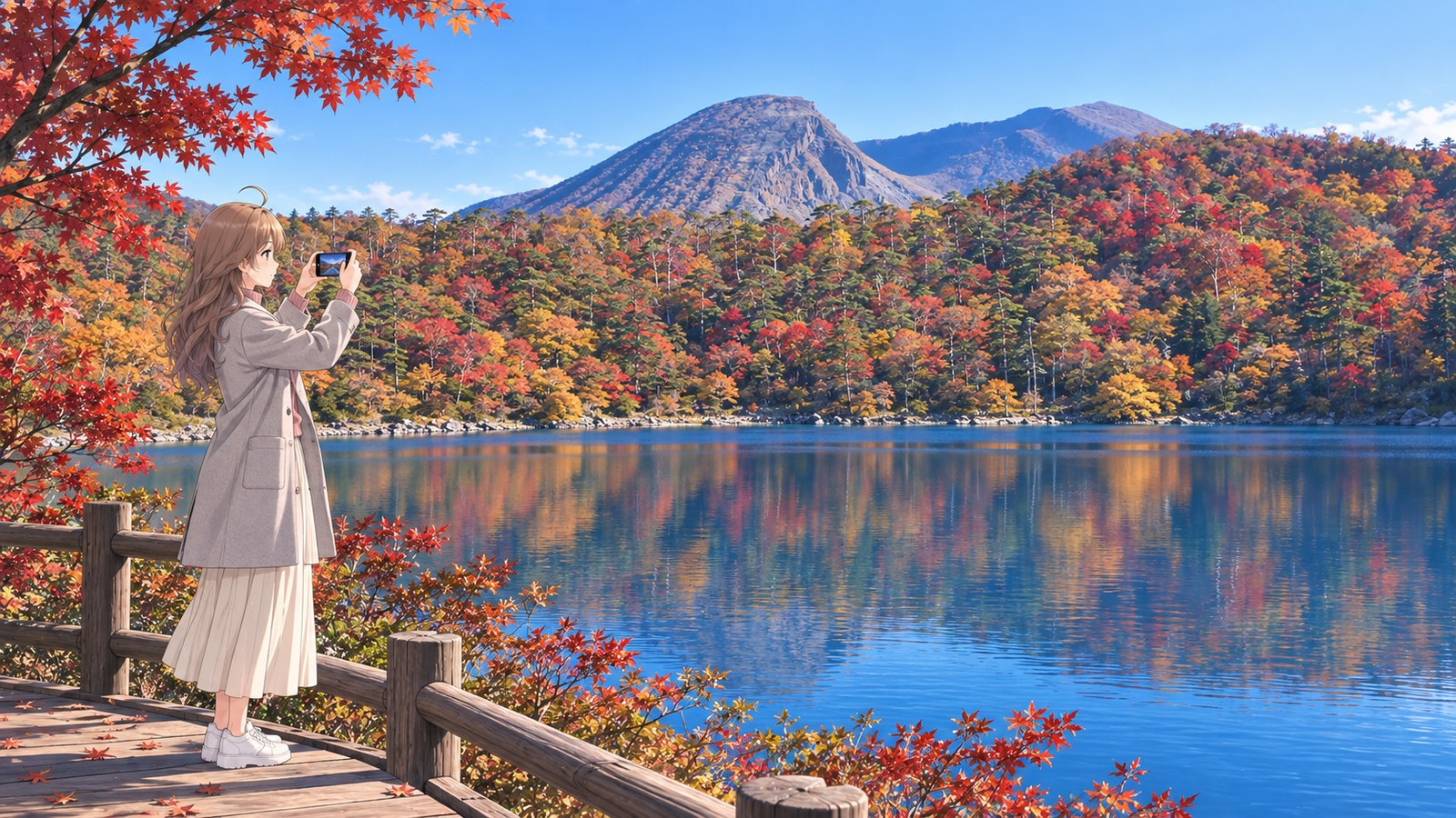 A woman by Rokkannonmiike holds her phone in both hands to photograph the autumn-coloured forest reflected in the lake, with mountains beyond.