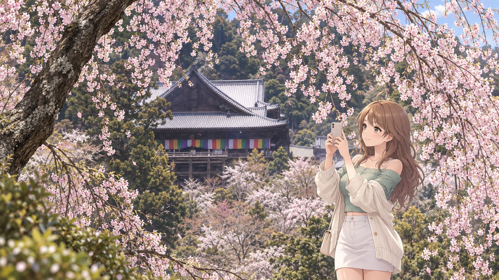 Cherry blossoms trail down in front of Hasedera’s main hall. A woman in a mint-green top, white miniskirt and cream cardigan holds up her phone to photograph the flowers and the hall.
