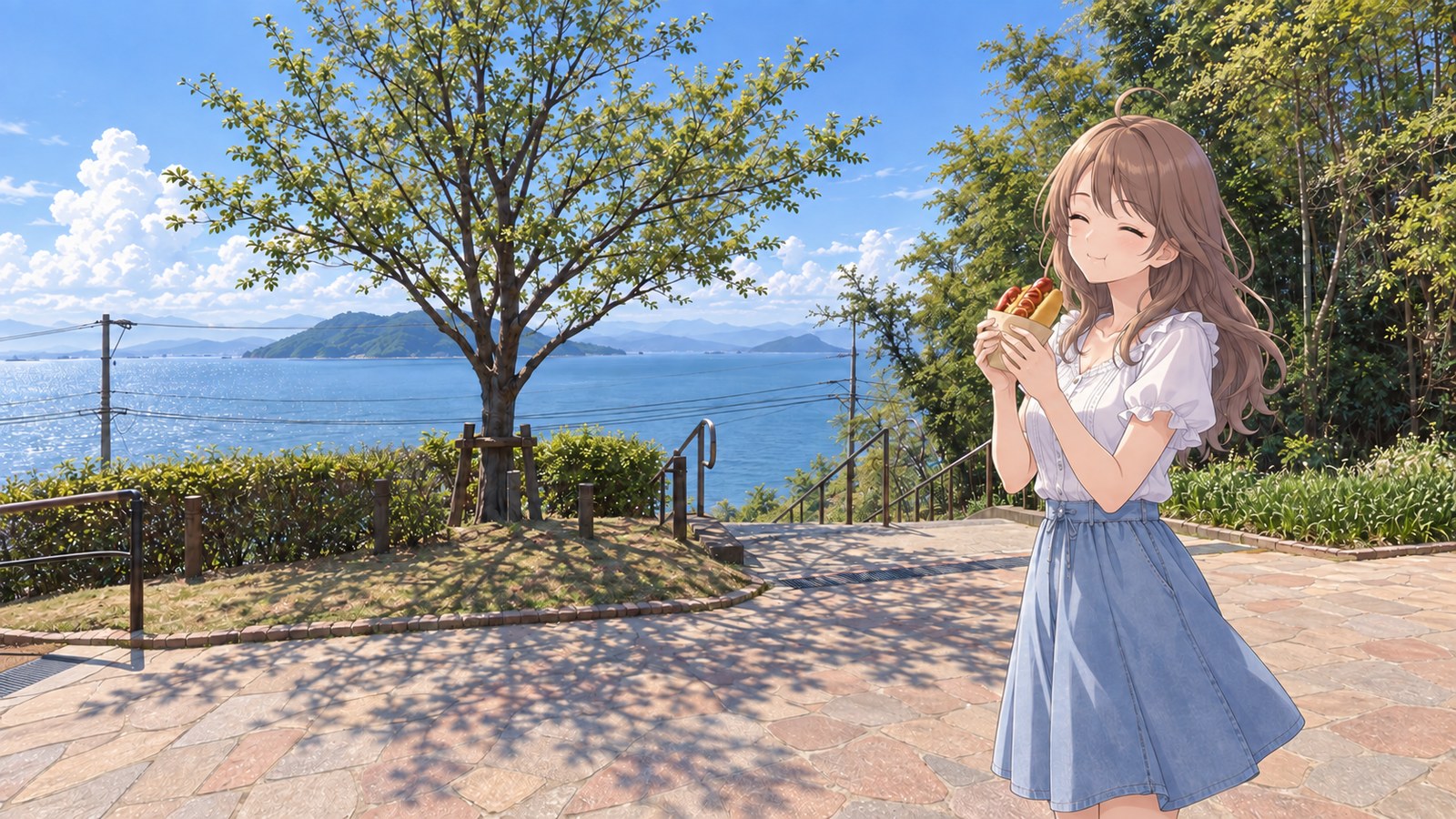 At the plaza at the top of the stairs in Kinin Park, the heroine, wearing a white frilled short-sleeved blouse and a denim skirt, holds a hot dog in both hands and savours it with her eyes closed. Hakata Bay lies beyond the trees and railing.