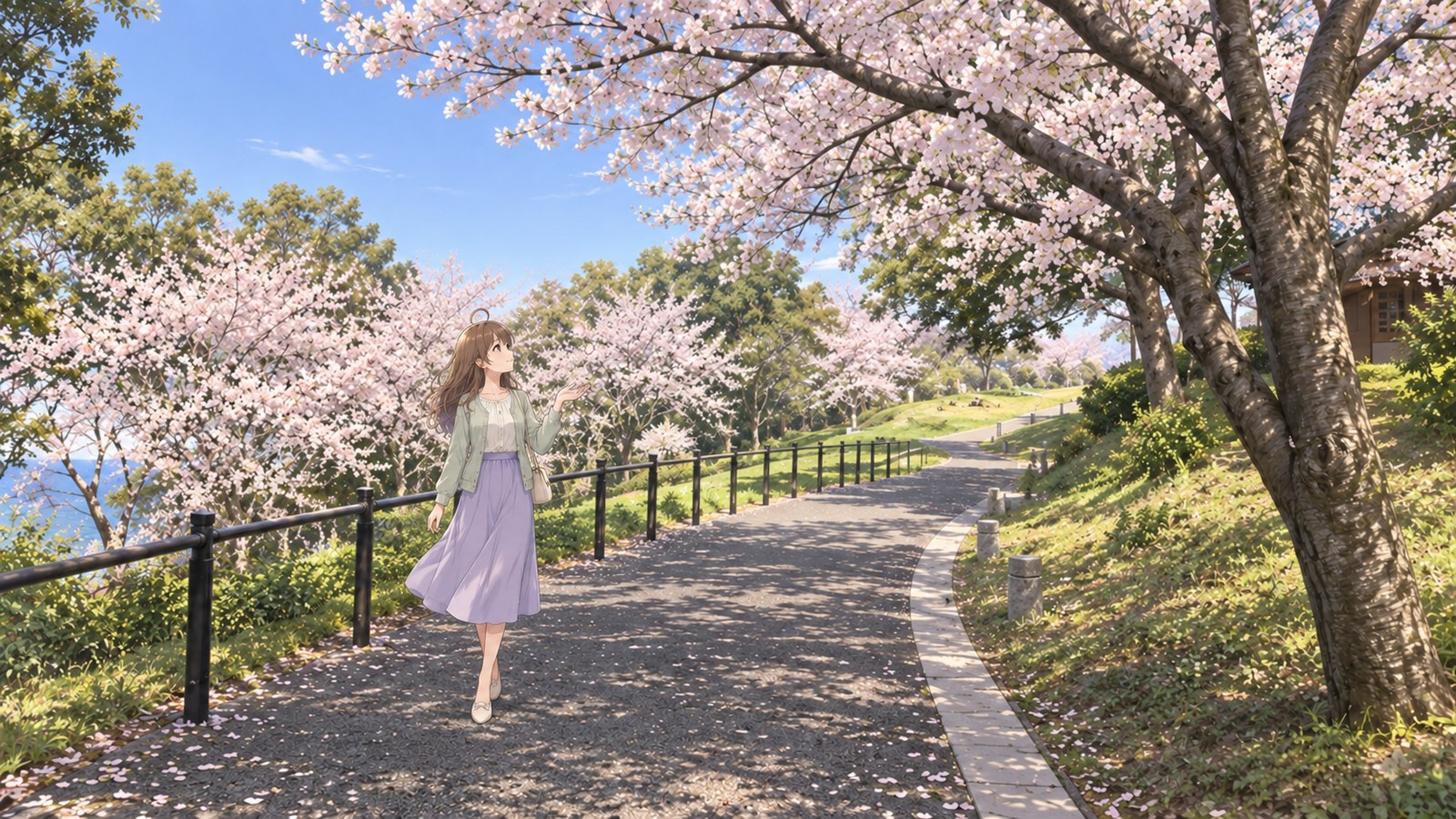 A woman in a pale green haori and light purple skirt stands on a cherry-lined path along the Yunoko Cherry Line, holding out an open hand towards the petals.