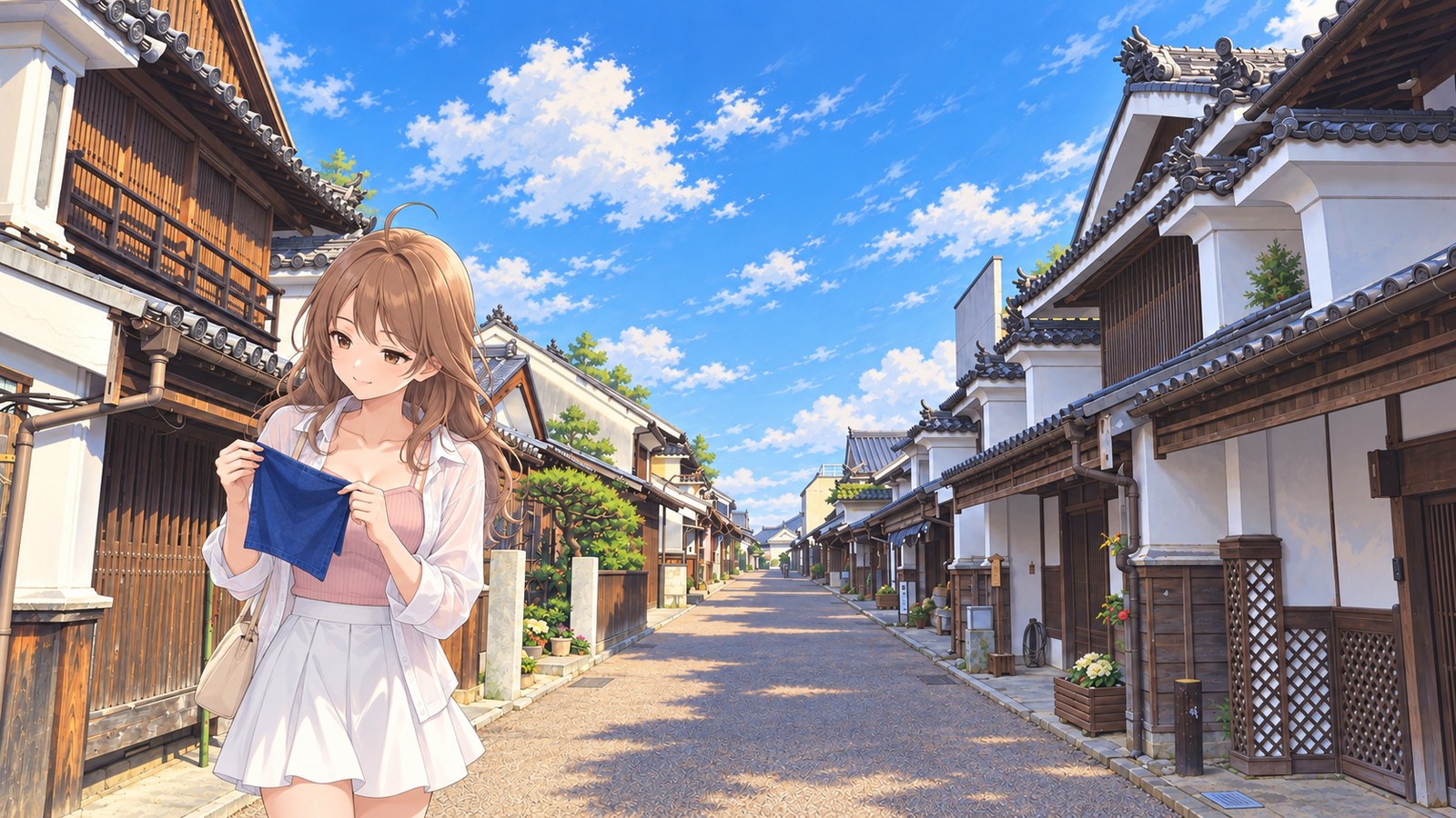 Against the white walls and wooden latticework of Wakimachi Udatsu Townscape, a woman wearing a pink top, white shirt, and flared mini skirt holds a small indigo handkerchief open in both hands and looks at it.