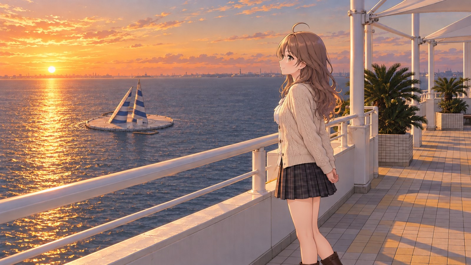 At sunset on the observation deck, a woman stands with her hands clasped behind her back, looking out at the sea. Two striped towers in navy blue and white rise from the middle of the water like sails.