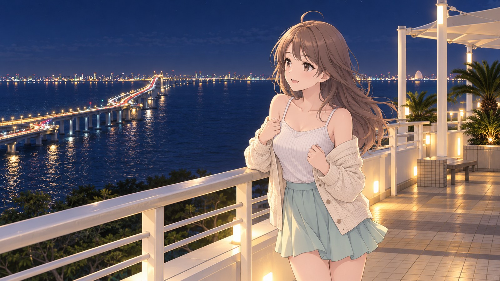 At night on the observation deck, a woman drapes a cardigan over her shoulders and looks out at the night view. A bridge lined with lights stretches across the sea, and the city lights along the shore shimmer on the water.